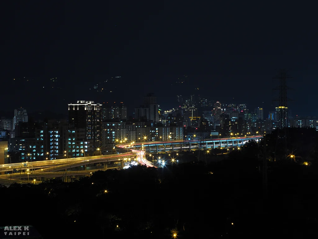 Light streaks from cars on a freeway in a city