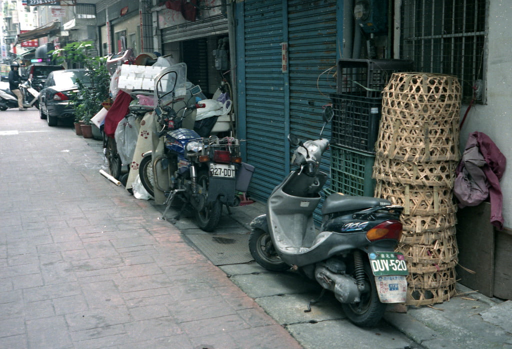 Scooter in a lane near a nigh market in Taipei. Photo taken with Olympus 35DC and Kodak Vision3.